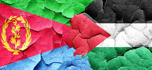 Eritrea flag with Palestine flag on a grunge cracked wall