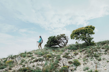 Hiker girl walking on hill