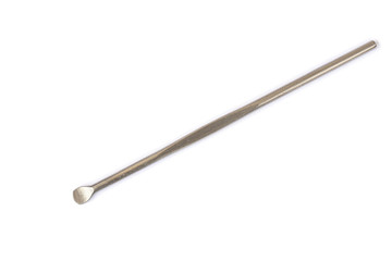 Close up metal earpick isolated on white