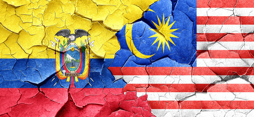 Ecuador flag with Malaysia flag on a grunge cracked wall