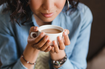 Close up of young beautiful unrecognizable woman hands holding h