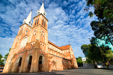 Fototapeta na wymiar Saigon Notre-Dame Cathedral Basilica (Basilica of Our Lady of The Immaculate Conception) on blue sky background in Ho Chi Minh city, Vietnam. Ho Chi Minh is a popular tourist destination of Asia.