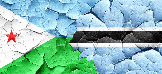 Djibouti flag with Botswana flag on a grunge cracked wall