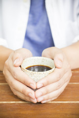 Man holding cup of coffee