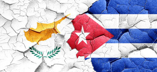 Cyprus flag with cuba flag on a grunge cracked wall