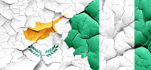 Cyprus flag with Nigeria flag on a grunge cracked wall