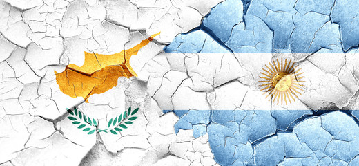 Cyprus flag with Argentine flag on a grunge cracked wall