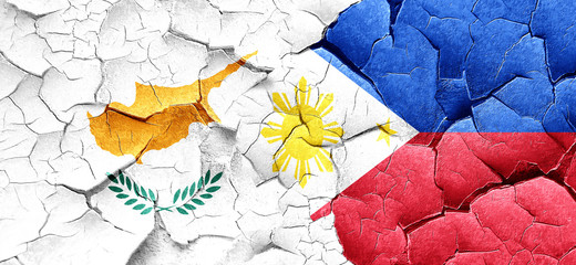 Cyprus flag with Philippines flag on a grunge cracked wall