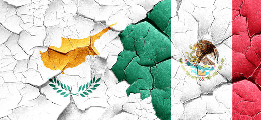 Cyprus flag with Mexico flag on a grunge cracked wall