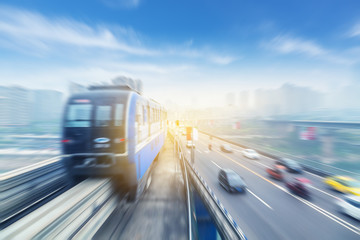 Obraz na płótnie Canvas light rail moving on railway in chongqing