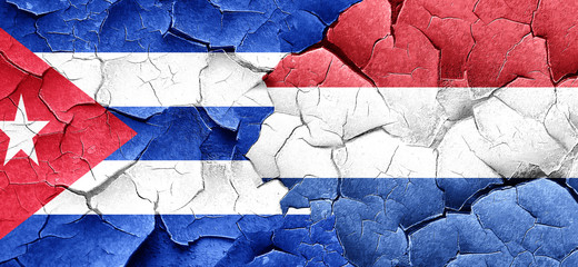 Cuba flag with Netherlands flag on a grunge cracked wall