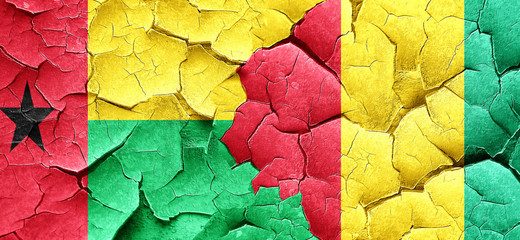 Guinea bissau flag with Guinea flag on a grunge cracked wall