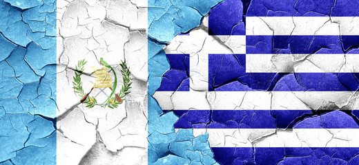 guatemala flag with Greece flag on a grunge cracked wall
