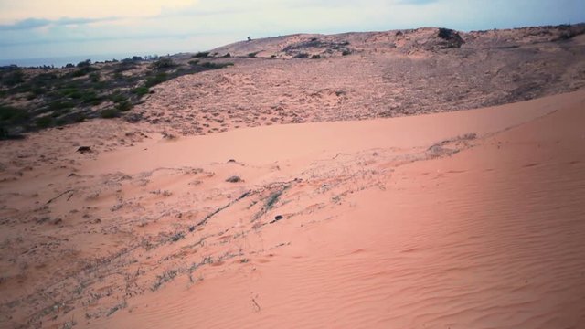 Red Sand Dune in Mui Ne, Vietnam. The famous place and impressive, tilt-up camera tracking shot, High quality in HD