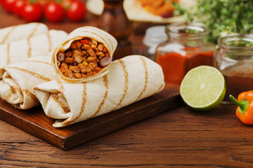 Burritos wraps with meat, beans and vegetables.