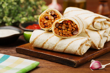 Burritos wraps with meat, beans and vegetables.