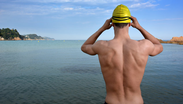 swimmer training on the beach