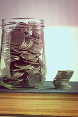 save money for investment concept money in the glass with filter