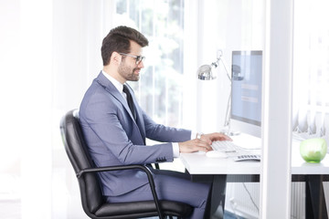 Log in to your computer, Young businessman working at office