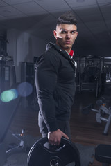 Bodybuilder hold dumbbell