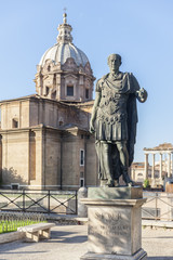 Statue Roman Emperor in with church in Rome