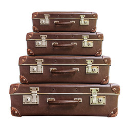 Four vintage brown suitcase on white background
