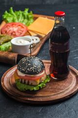 Fototapeta na wymiar black burger with grilled chicken patty 