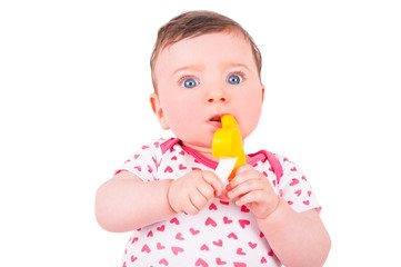 Baby girl with rattle teether toy. 