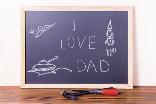 concept of Father's Day with handwritten text I Love Dad and pic