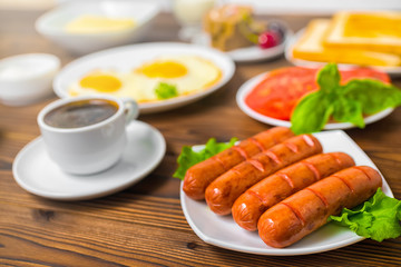 breakfast with setting food products over wooden background, clo