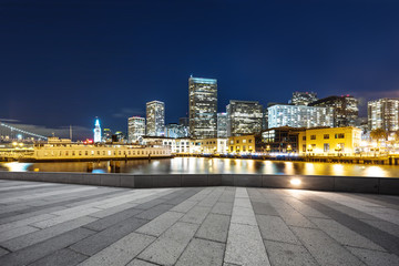 empty floor with modern buildings near water in san francisco