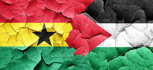 Ghana flag with Palestine flag on a grunge cracked wall