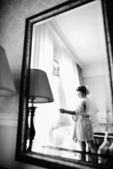The bride looking at her dress