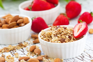 Oat granola with almond, chocolate and fresh strawberry