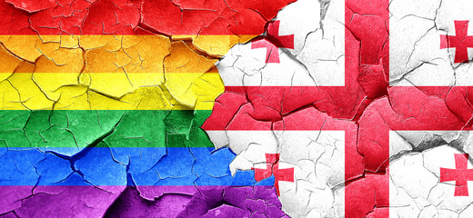 Gay pride flag with Georgia flag on a grunge cracked wall