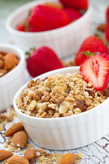 Oat granola with almond, chocolate and fresh strawberry