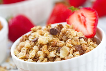 Oat granola with almond, chocolate and fresh strawberry