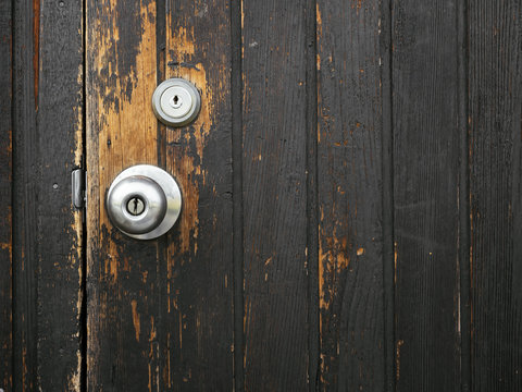 Old door knob on Wooden door Textured