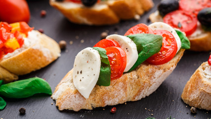 Bruschetta with tomatoes, mozzarella and basil
