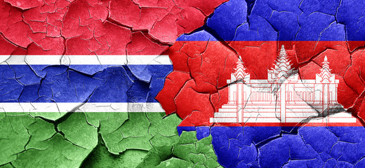 Gambia flag with Cambodia flag on a grunge cracked wall