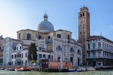 Fototapeta na wymiar Old church with tower on the venetian street, Venice