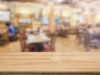 wooden counter top with restaurant blurred background