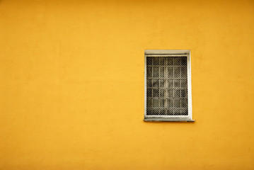 Window in yellow wall