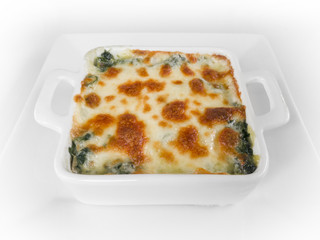 Baked spinach and cheese on the white background.