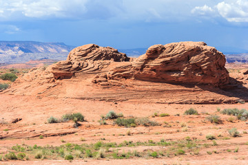 Layered rock in dry and arid desert around Glen Canyon National Recreation  Area