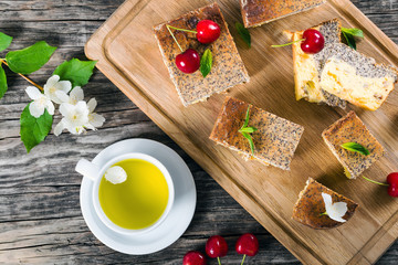 homemade cheesecake with poppy seeds on a cutting board, close-u