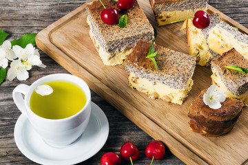 homemade cheesecake with poppy seeds on a cutting board, close-u