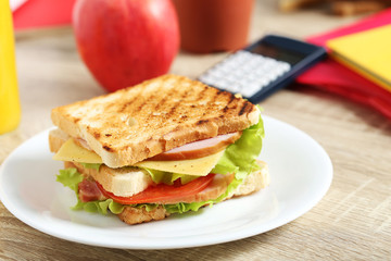 Tasty and fresh sandwiches on a brown table