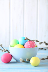 Easter eggs on a blue wooden table