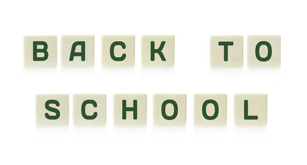  "Back to school" on board game square plastic tile pieces, isolated on a white background.